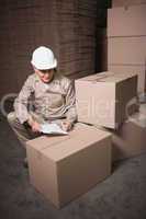 Warehouse worker with clipboard