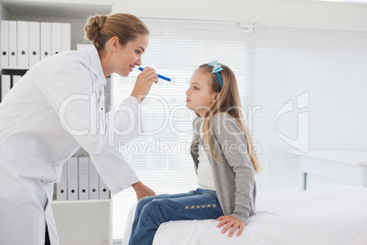 Doctor checking patients eyes
