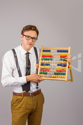 Geeky businessman using an abacus