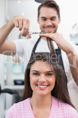 Pretty brunette getting her hair cut