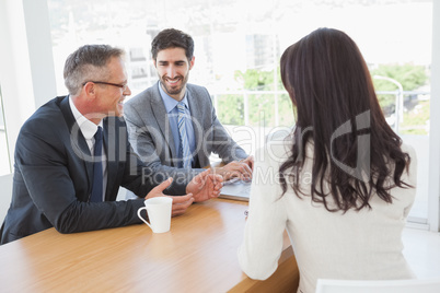 Happy business team talking together