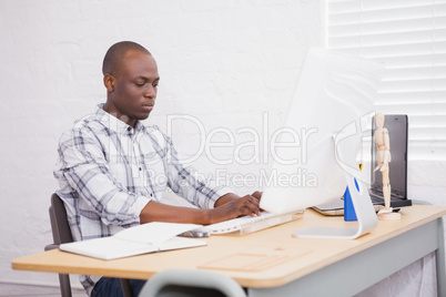 Focused businessman sitting at his desk working