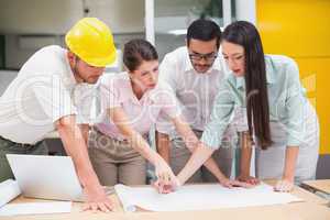 Architecture team working together at desk