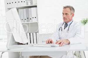 Doctor using his work computer