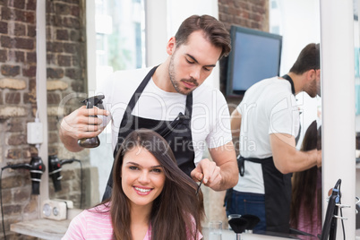 Pretty brunette getting her hair cut