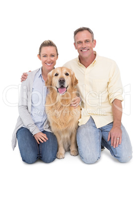 Portrait of smiling couple sitting together with their dog