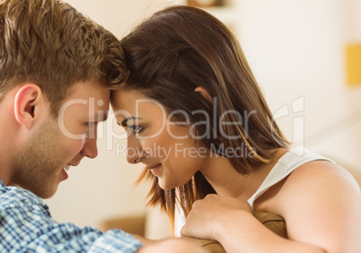 Happy young couple relaxing on the couch Happy young couple relaxing on the couch