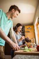 Cute couple preparing food together