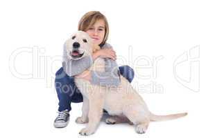 Portrait of cute boy hugging his dog