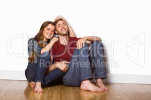 Young couple sitting on floor