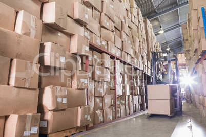 Forklift machine in warehouse