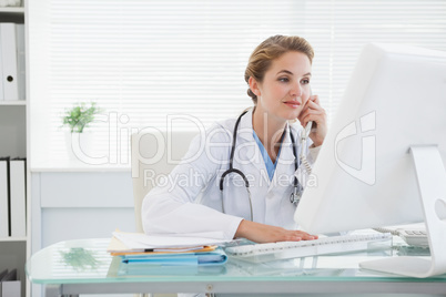 Doctor answering a telephone call