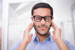 Close up of businessman with severe headache