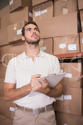 Warehouse worker with clipboard