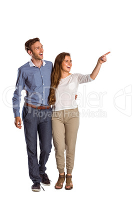 Full length of couple looking away