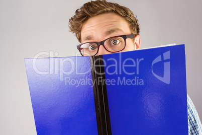 Geeky student reading a book