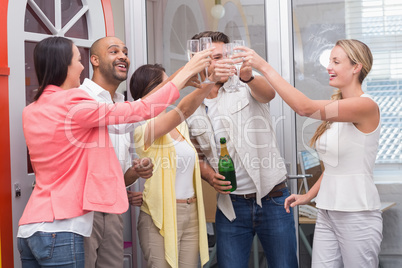 Casual business team toasting with champagne