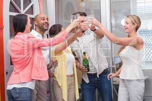 Casual business team toasting with champagne