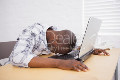 Casual businessman sleeping at his desk Casual businessman sleeping at his desk