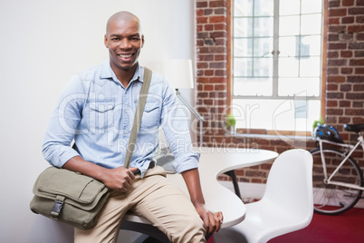 Casual businessman smiling at camera