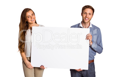 Happy young couple with blank board Happy young couple with blank board