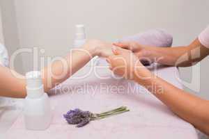 Woman getting a hand massage