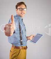 Geeky businessman using his tablet pc