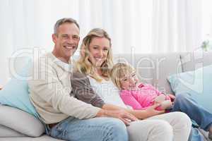 Happy family relaxing on the couch