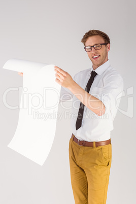 Geeky businessman reading large page