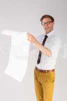 Geeky businessman reading large page