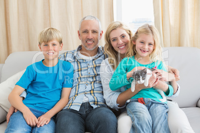 Happy family with their pet kitten