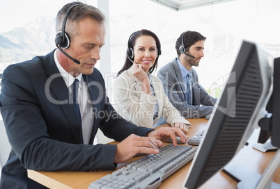 Smiling businesswoman working with teammates