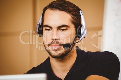 Businessman using headset in distribution warehouse