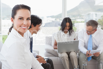 Happy businesswoman smiling at camera