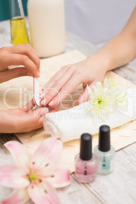 Nail technician giving customer a manicure