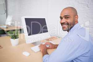Businessman using computer at desk