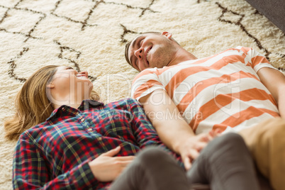 Cute couple lying on floor