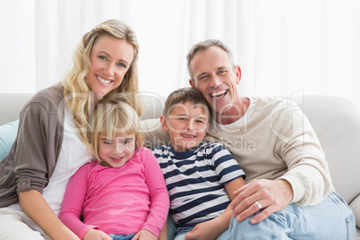 Portrait of a cheerful family on the couche