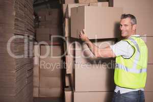 Worker loading up pallet