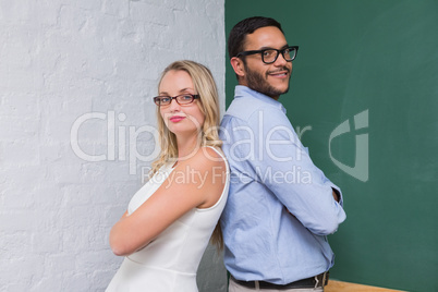 Confident business people with arms crossed Confident business people with arms crossed