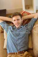 Young man relaxing on his couch