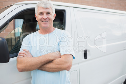 Smiling man in front of delivery van