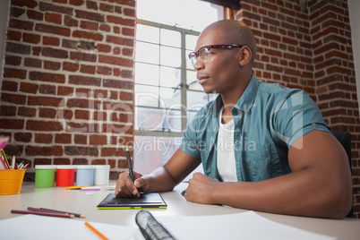 Designer sketching on graphics tablet