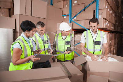 People at work in warehouse