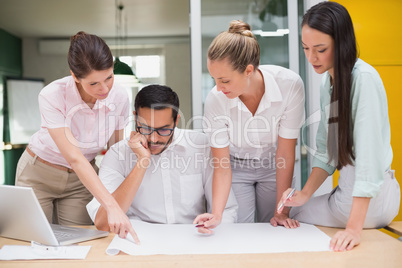 Architecture team working together at desk