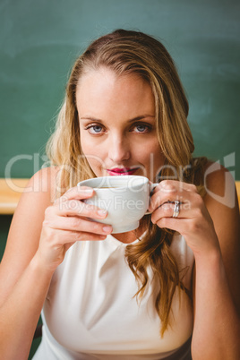 Beautiful businesswoman drinking coffee