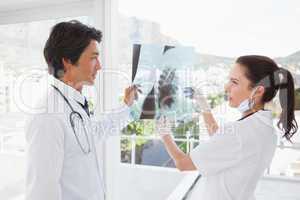 Doctors both looking over an x ray