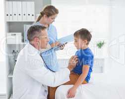 Doctor checking a patients heartbeat