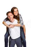 Smiling young man carrying woman