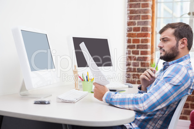 Casual businessman working at his desk